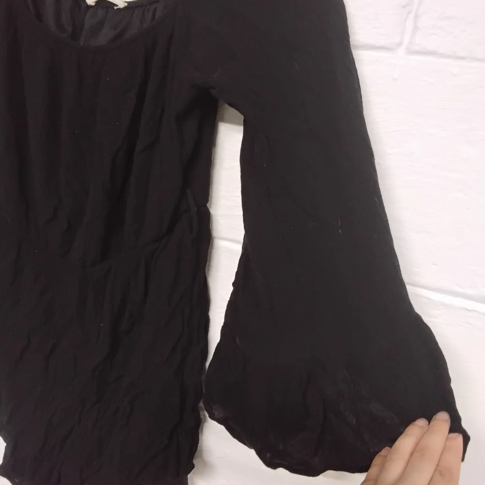 Black Flowy Long Sleeve Romper - Picture 2 of 3